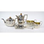A matched silver five-piece tea service of elongated octagonal form with engraved decoration,