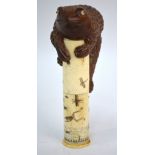 An oriental bone pen-holder, the cylindrical body decorated with insects and frogs,