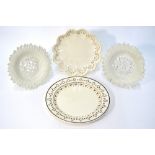 Four early 19th century English creamware items comprising: two circular dishes in the form of