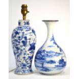 Two blue and white vases, comprising: one depicting birds and flowers,