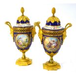 A pair of 19th century French ormolu mounted porcelain pot pourri vases in the Sevres style,