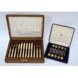 A cased part set of ten Art Deco silver gilt coffee spoons with circular bowls and flared stems,