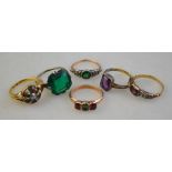 An emerald and diamond dome shaped cluster ring, to/w five paste set rings, mostly gold set,