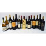 A collection of fifteen bottles of red and white wine including Chateau Cadillac 2000 Bordeaux