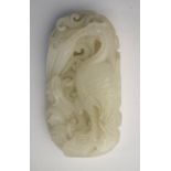 A Chinese green jade of whitish hue, carved as a Cormorant,