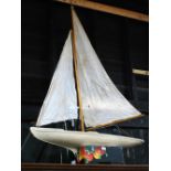 A large Edwardian plank-constructed pond yacht with weighted keel and painted hull,