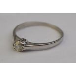 A single stone old cut diamond ring in white metal collet setting, approx 0.