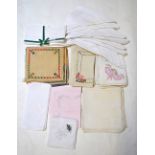 A set of twelve large white linen napkins, an embroidered set of eight table napkins,