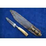 A 19th century Continental knife with 11 cm steel blade, ribbed ferrule and antler handle,