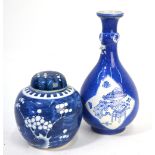 Two pieces of Chinese blue and white porcelain, comprising: a powder-blue ground bottle vase,