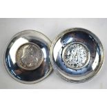 Two Maltese white metal pin-dishes, each loose-mounted with a 30 Tari piece,
