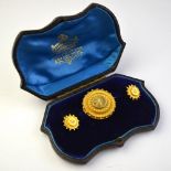 A Victorian suite of target brooch and matching earrings set with small half pearls, yellow gold,