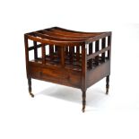 A late 19th century mahogany four-division Canterbury with drawer to base,