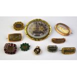 A collection of nine various mourning brooches and one small locket including oval hairwork picture