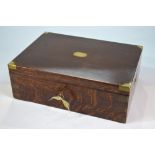 A brass-bound oak canteen, the blue baize-lined interior fitted with a tray, flush side handles,