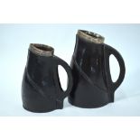 Two Doulton Lambeth leather ware Cromwellian style blackjacks with silver rim,