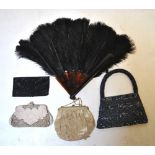 A late 19th century lace lappet, four beaded evening bags, a peacock feather fan,