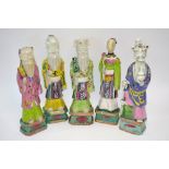 A set of five famille rose, Chinese porcelain figures of standing Daoist Immortals,