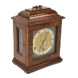 A burr walnut Georgian style cased mantel clock with Elliott 8-day Westminster/Whittington chime