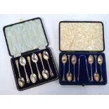 A Victorian cased silver gilt set of teaspoons with scroll finials and shell bowls,