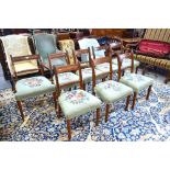 A set of eight Regency mahogany ropeback dining chairs,