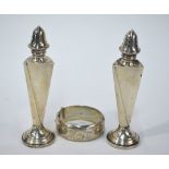 A US sterling salt and pepper pair of tapering triangular form, on weighted foot, Fairchild & Co.