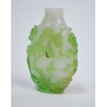 A single green overlay glass, Chinese snuff bottle, decorated with pine,