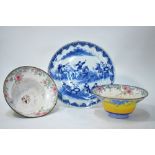 A pair of yellow-ground, Canton-style, Chinese enamel bowls decorated with floral designs,