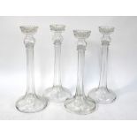 A set of four tall hollow stemmed glass candlesticks, possibly 19th century, 37.