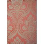 A pair of lined and inter-lined damask curtains, terracotta ground with foliate and floral design,