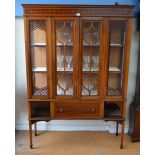 A late 19th/20th century inlaid satinwood display cabinet with drawer beneath,