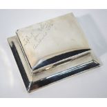 A silver cigarette box with flared foot, inscribed 'To Paul from Dopey, Christmas 1924',
