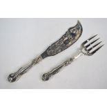 A pair of Victorian silver fish servers, the slice-blade pierced and engraved with a hippocampus,