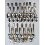 A quantity of Georgian and Victorian silver fiddle pattern teaspoons - sets and part sets -