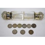 A Victorian plain cylindrical glass double-ended scent bottle with cased silver bun covers,