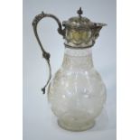 A Victorian glass claret jug, finely etched with shamrock and other foliage,