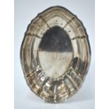 A US sterling oval dish of ogee form, 'Chippendale' pattern, by Gorham 12.