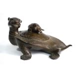 A Japanese bronze koro, designed as a mythological minogame with a smaller minogame on its back,