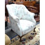 An Edwardian tub shaped armchair,