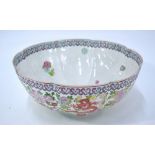 A famille rose 'egg-shell' bowl, decorated with dragon and floral designs, 27cm diameter,