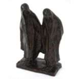 A brown-patinated bronze group of two cowled figures, signed indistinctly, early 20th century,