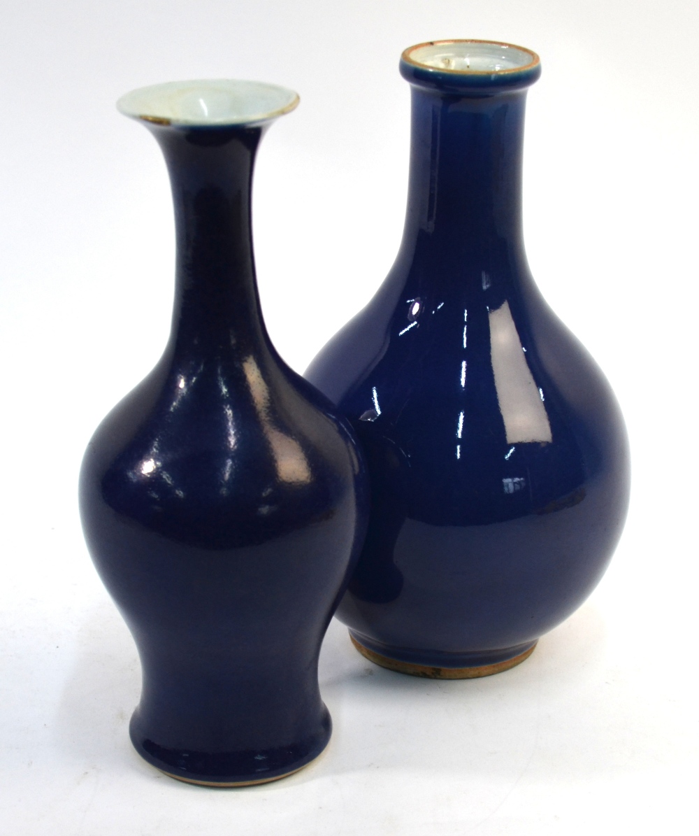 Two Chinese blue monochrome vases; one with flaring trumpet neck,