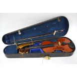 A late 19th century German violin with 'Stradivarius' inner label, two piece flame mahogany back, l.
