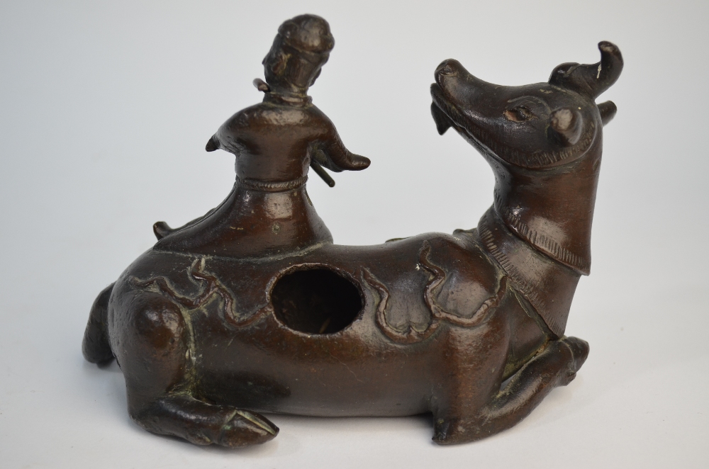 A Chinese bronze figure of a scholar seated on a recumbent buffalo, possibly a mirror stand, - Image 3 of 6