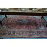 A fine Afghan runner with seven star medallions on rust ground within repeating border,