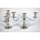 A pair of plated on copper twin-branch candelabra with three sconces and detachable tops,