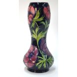A Moorcroft contemporary vase of waisted form decorated with the 'Anemone' pattern on a blue ground,