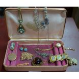 A collection of vintage jewellery items including circular engine turned locket stamped 10ct,