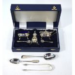 A cased three-piece silver condiment set with spoons and blue glass liners, Birmingham 1997,