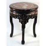 An antique Chinese circular rosewood stand, the top with inset veined marble,
